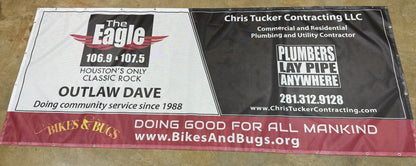 A promotional banner divided into two sections: on the left, a graphic for "the eagle 106.9" radio station, on the right, advertising for "Chris Tucker Contracting LLC", produced using Show Off Your Threads' Custom Mesh Indoor/Outdoor Banner, Next Day Pick Up!