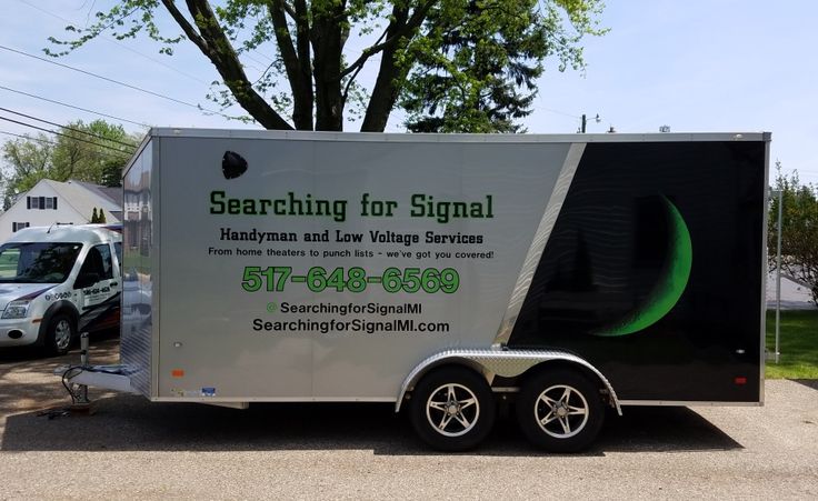 Custom printed trailer decals available for roofing vans ensuring professional and cohesive brand identity.