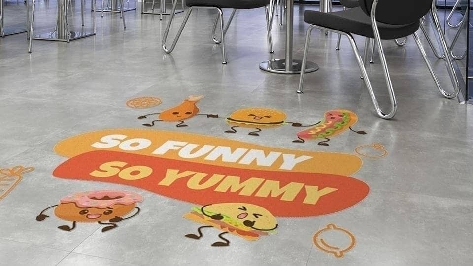 High-impact custom printed floor decals designed to enhance brand visibility and promote a professional appearance in various work environments.