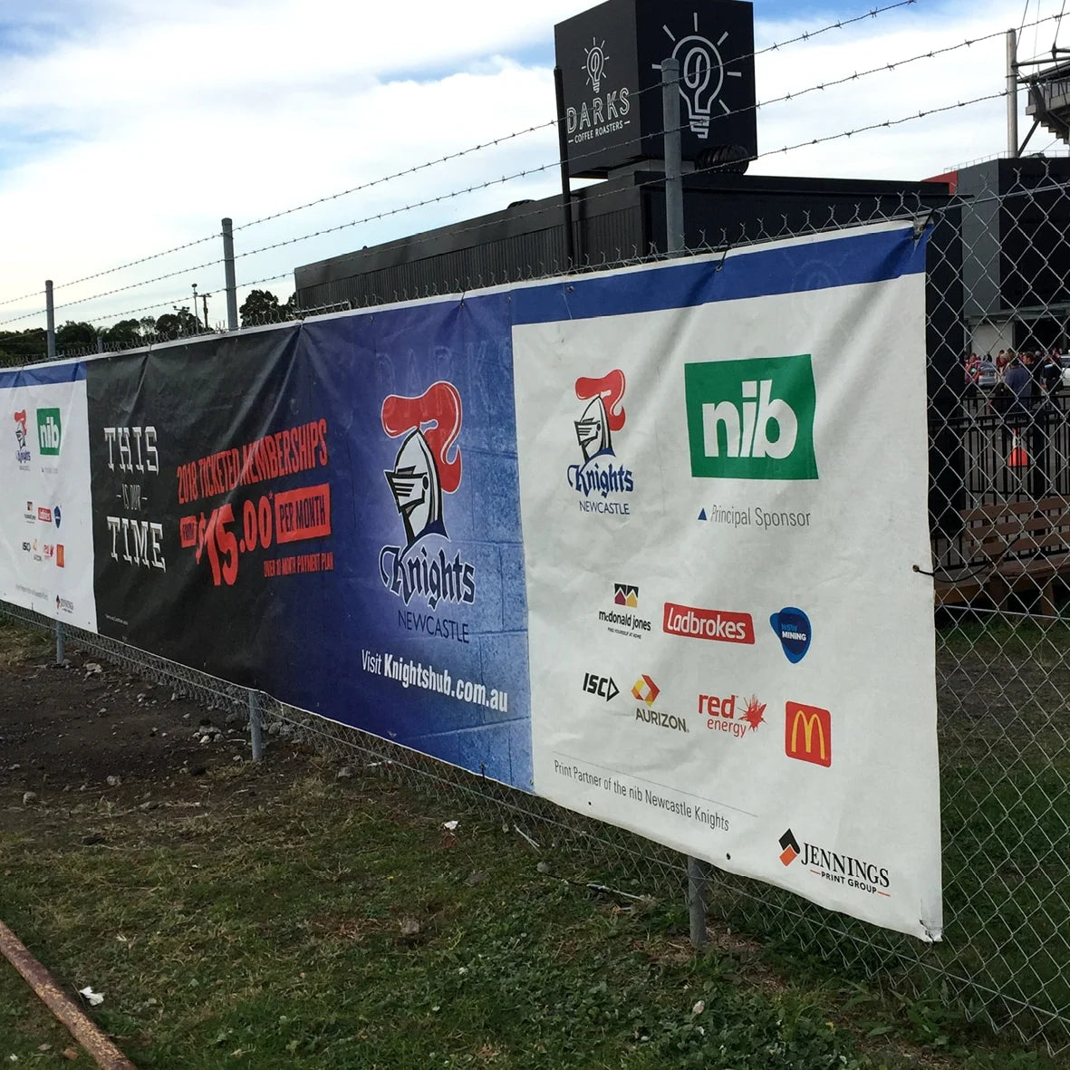 Full-color printed fence banners for maximum visibility.